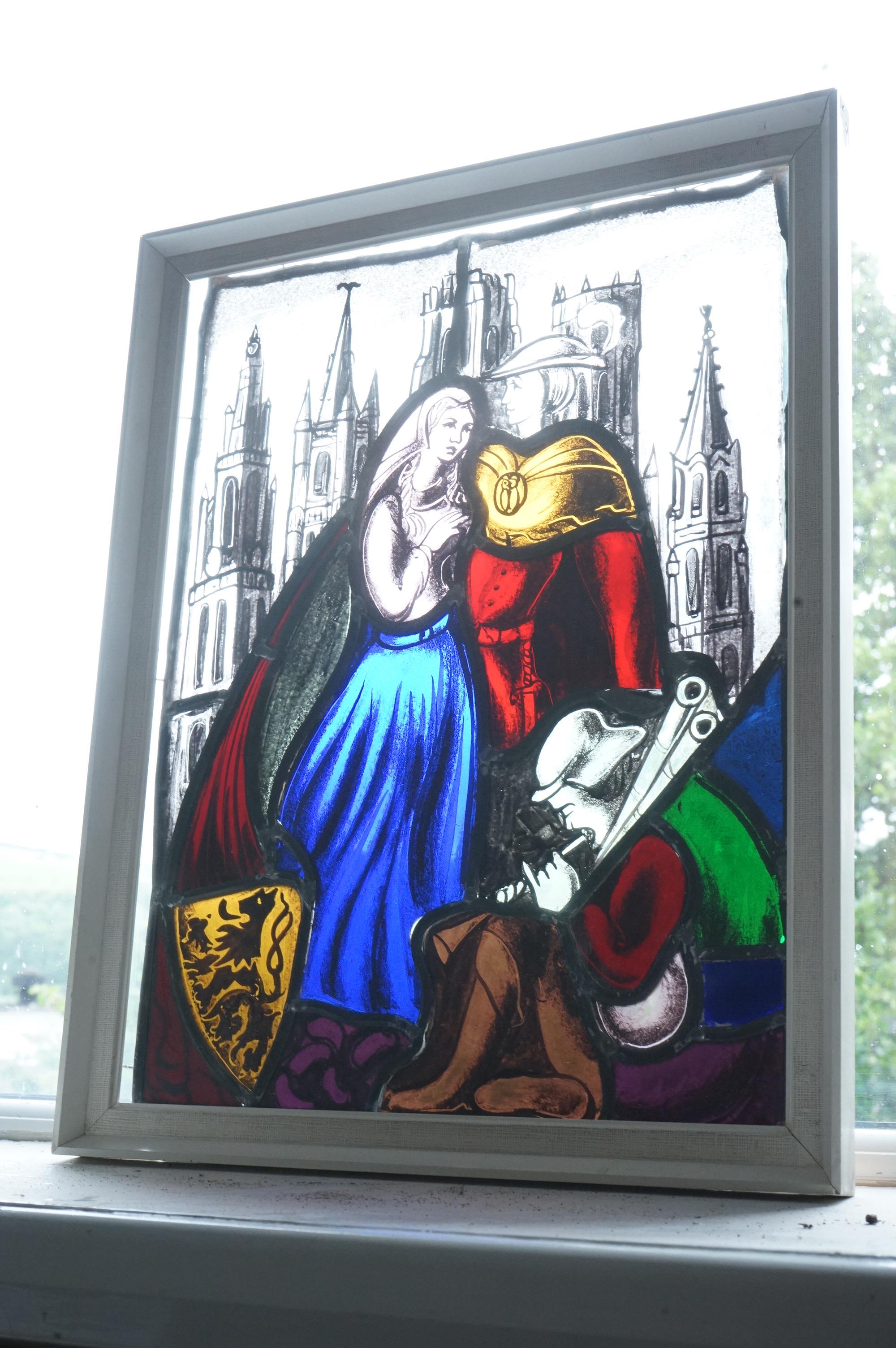 A stained and leaded glass panel of a romantic couple in front of a cathedral, 48cm high